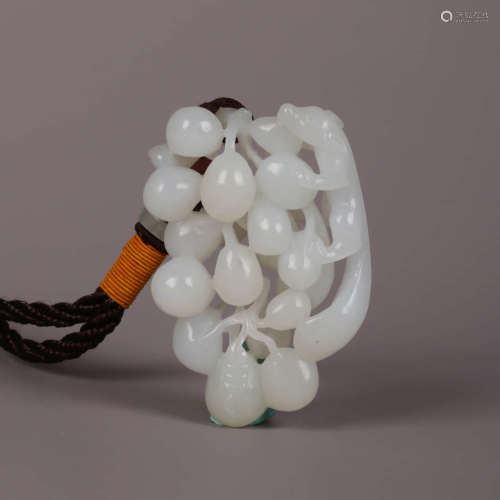 A Carved White Jade Squirrel And Grapes Ornament