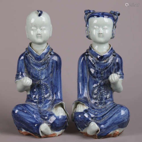 A Pair Of Blue And White Children Ornaments
