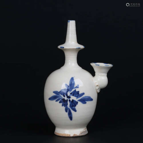 A Blue And White Floral Buddhist Vase