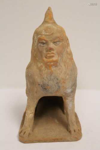 A rare possible Han pottery sculpture of beast with human fa...