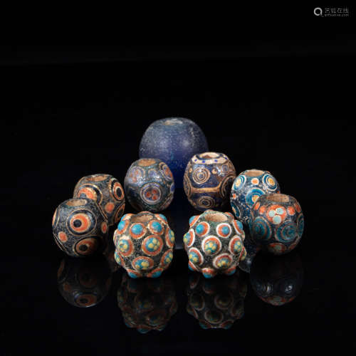 A GROUP OF COLORED GLAZE BEADS, HAN DYNASTY, CHINA