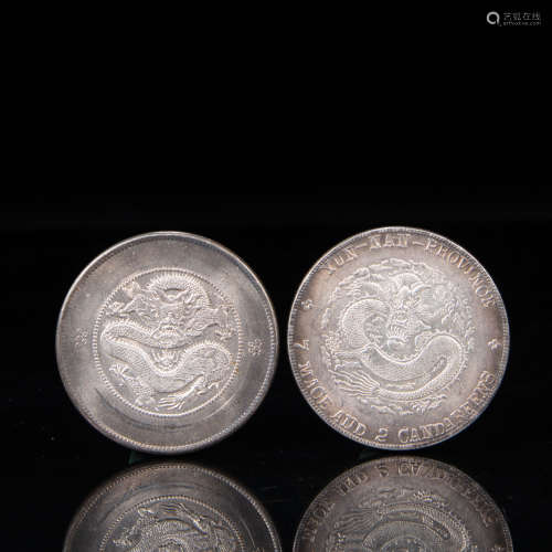 A PAIR OF CHINESE QING DYNASTY SILVER DOLLARS