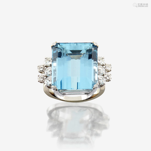 An aquamarine, diamond, and eighteen karat white gold