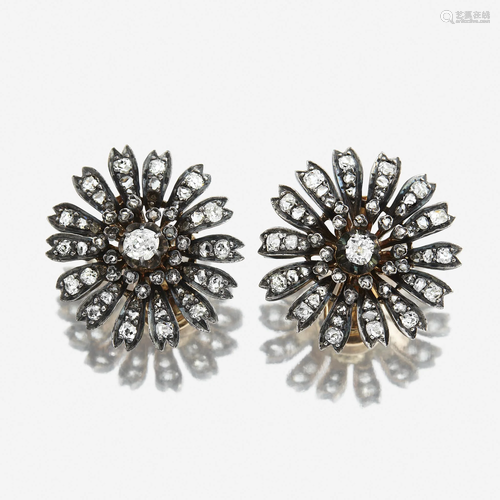 A pair of antique diamond earrings