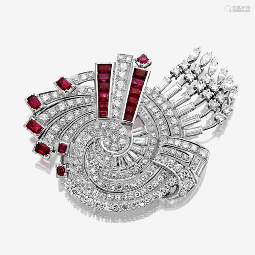 A diamond, ruby, and platinum brooch