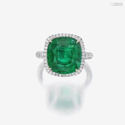 An emerald, diamond, and platinum ring