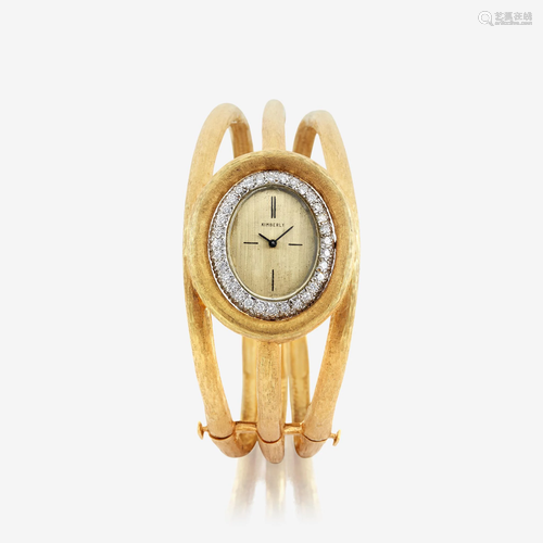 A diamond and eighteen karat gold bangle watch