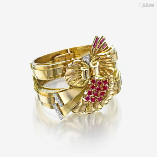 A Retro eighteen karat gold, ruby, and diamond bangle