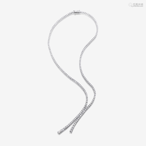 A diamond and eighteen karat white gold lariat necklace