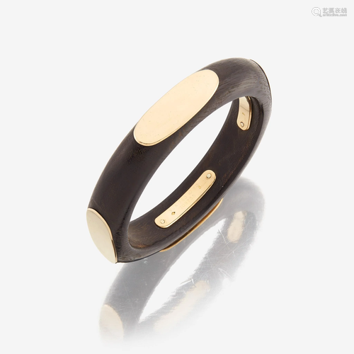 An eighteen karat gold and wooden bangle, Van Cleef &