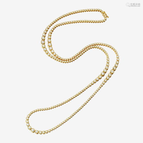 A diamond and fourteen karat gold necklace