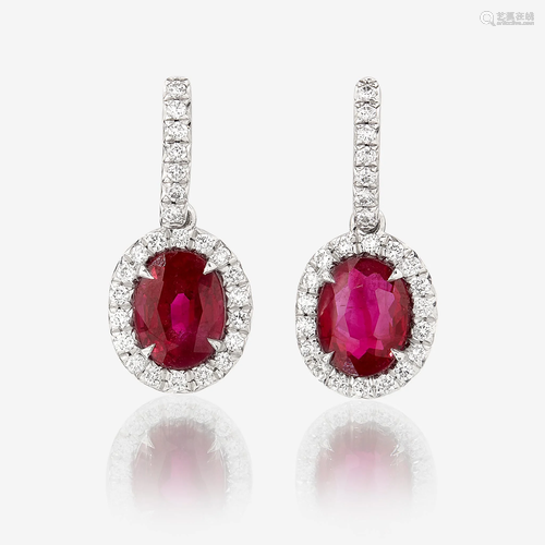 A pair of ruby, diamond, and platinum earrings