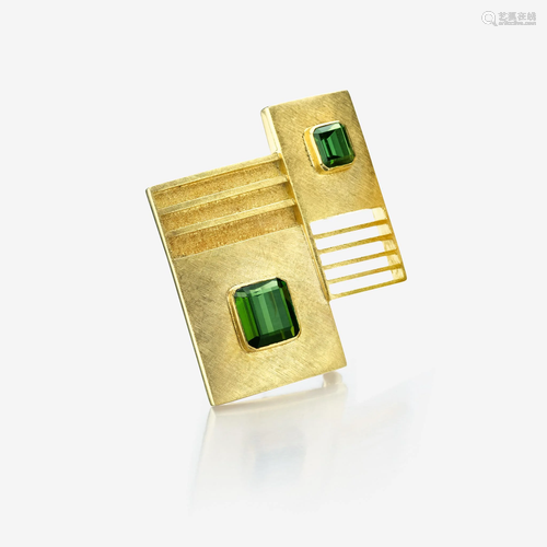 An eighteen karat gold and green tourmaline brooch,