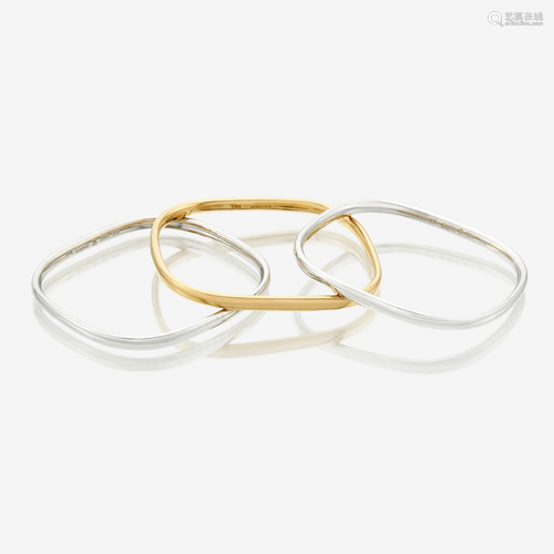 A collection of three eighteen karat gold bangles,