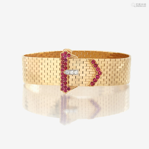 A fourteen karat gold, ruby, and diamond strap