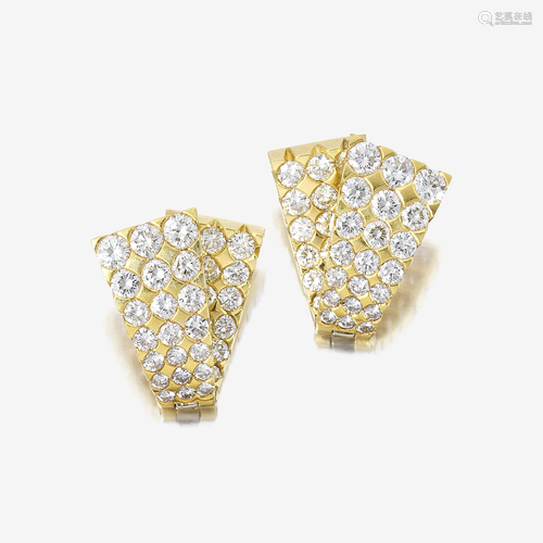 A pair of diamond and eighteen karat gold earrings