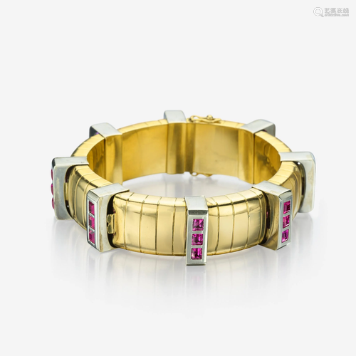 An eighteen karat bicolor gold and pink sapphire