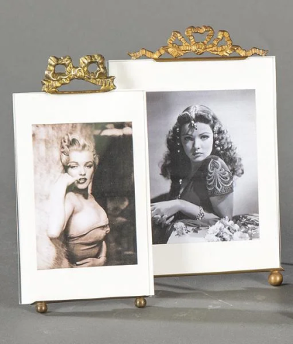 Two tabletop picture frames in bronze and beveled