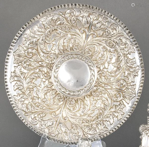 Embossed and chiselled circular tray in silver possibly