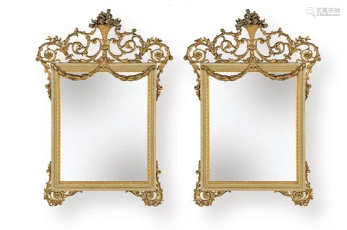 Pair of Louis XVI mirrors in carved, openwork,