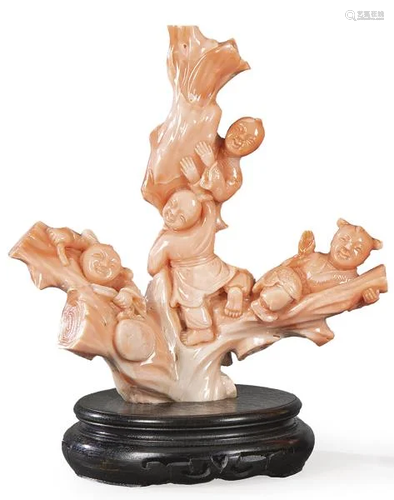 Pink coral branch carved with three children, China