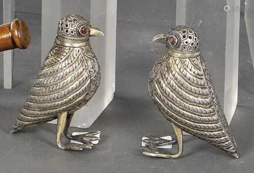 Pair of silver salt and pepper shakers in the shape of