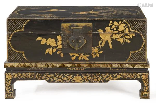 Chinese chest lacquered in black with golden decoration