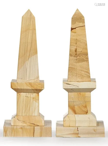 Pair of obelisks in cream colored marbled marble.