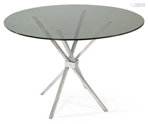 Round dining table with chromed metal legs and smoked