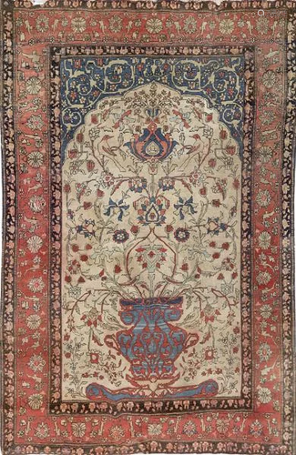 Persian carpet in wool and silk. With a central vase