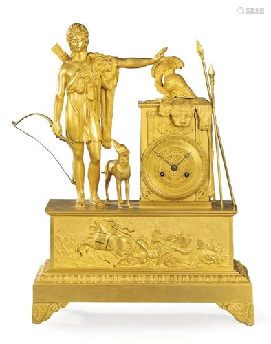 Empire table clock in gilt bronze. On a rectangular