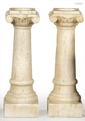 Pair of small carved white marble Ionic columns, Spain