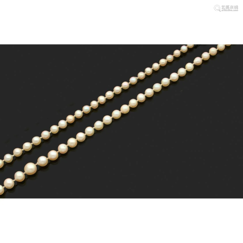 Cultured pearls necklace, one of which has been