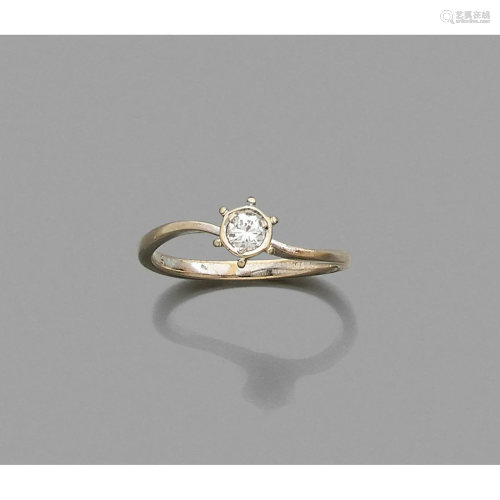 Platinum ring adorned with a brilliant cut diamond of