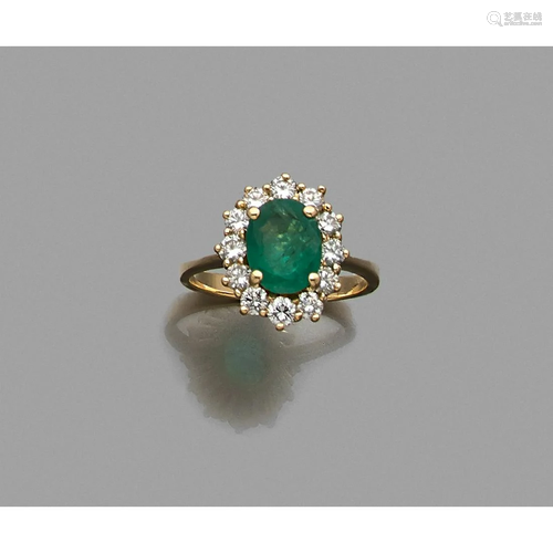 Yellow gold ring adorned with an oval emerald