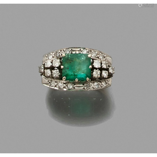 White gold ring adorned with a rectangular emerald in
