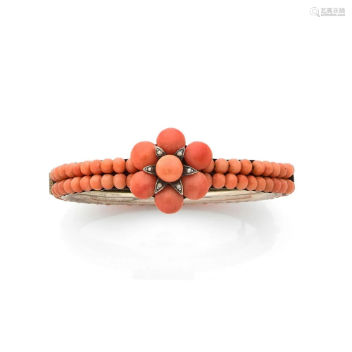 19th century work. Silver bangle adorned with a coral