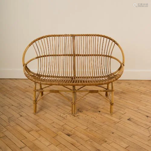 A FRENCH CURVED BACK RATTAN SETTEE CIRCA 1950.