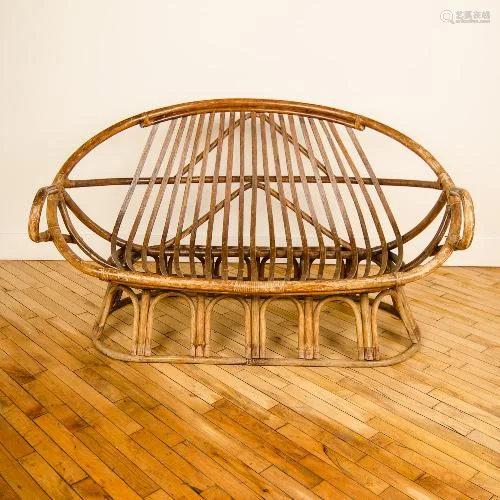 A FRENCH CURVED BACK RATTAN SETTEE CIRCA 1960.