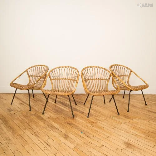 A SET OF FOUR MCM RATTAN CHAIRS WITH IRON LEGS