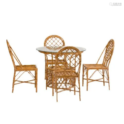 A RATTAN DINING ROOM TABLE AND FOUR CHAIRS