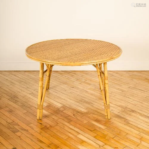 A ROUND FRENCH MCM RATTAN DINING ROOM TABLE