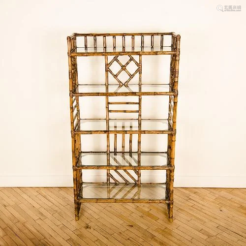 A MID CENTURY FRENCH RATTAN AND GLASS BOOK SHELF