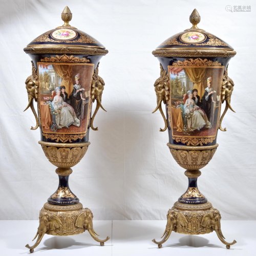 Pair of large porcelain and bronze urns
