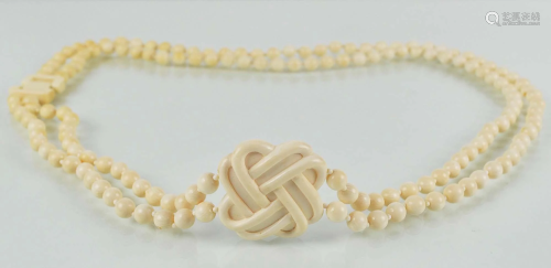 Bone pearl necklace with medallion