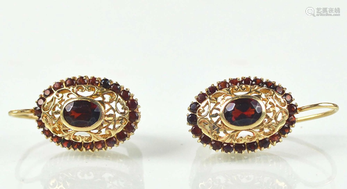 Pair of gold earrings with garnets