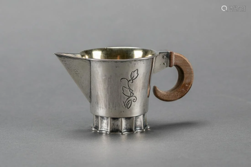 silver milk jug