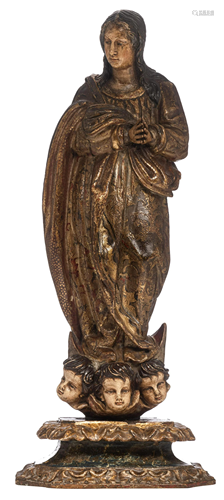 A sculpture of the Madonna on the crescent moon,