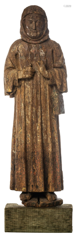 A 16th/17thC oak sculpture depicting a monk with a