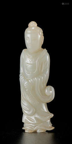 A RARE WHITE AND RUSSET JADE FIGURE OF GUANYIN Song/Yuan Dyn...